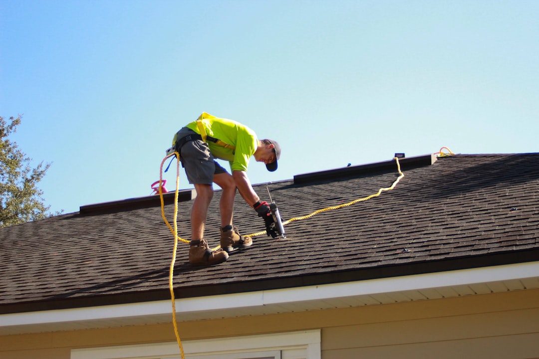 story-02 a-man-working-on-a-roof-with-a-power-drill-scaj0t40nfi